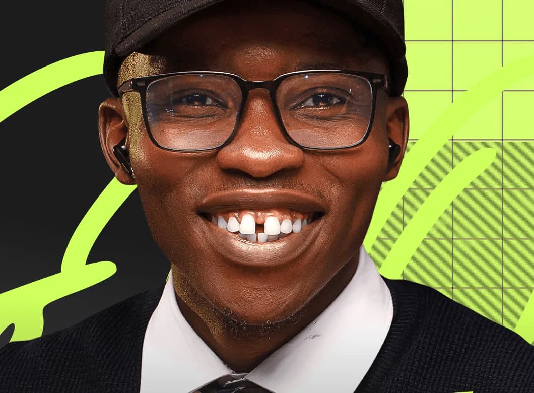 Maxwell, host of The Nigerian Student Podcast, smiling in a cap and glasses