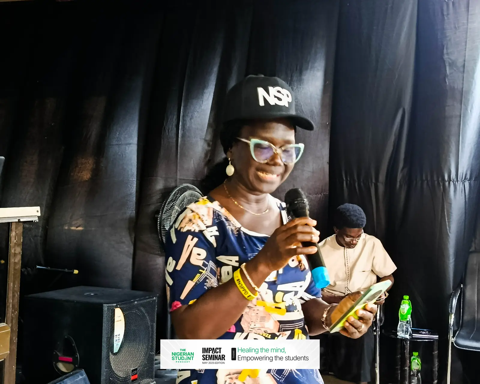 A speaker in an NSP cap answers questions